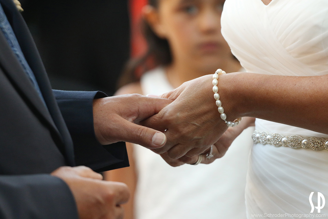 Close up of Bride and Groom holding hands during the ceremony